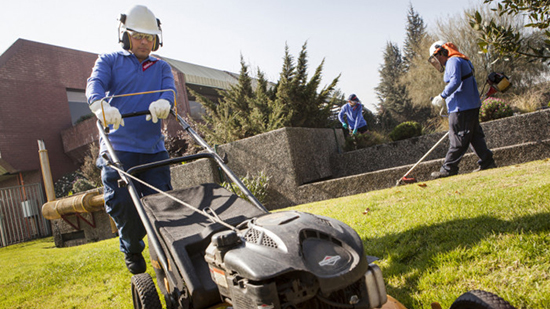 Sodexo employee mows the lawn