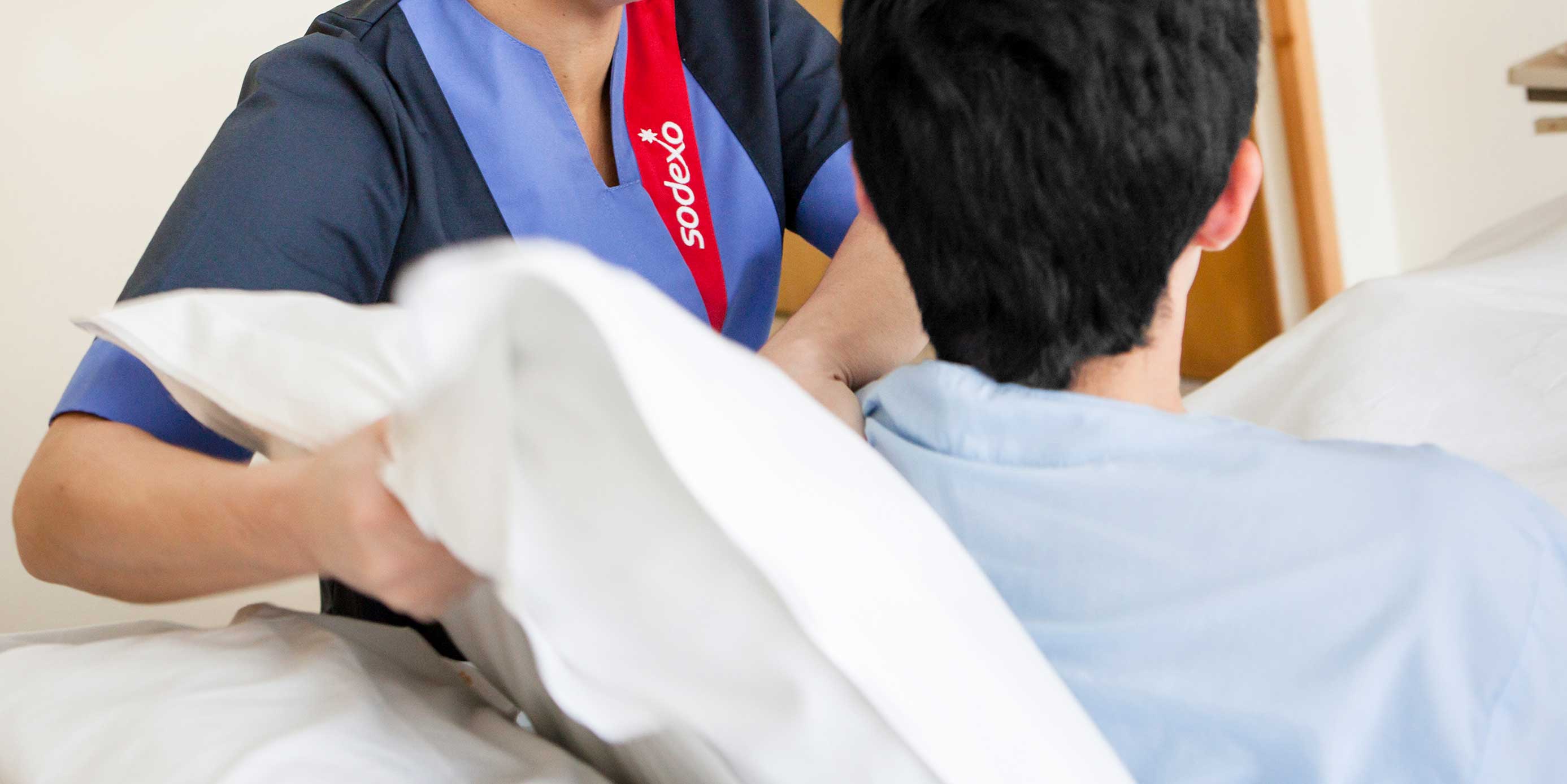 A healthcare provider helping a senior citizen