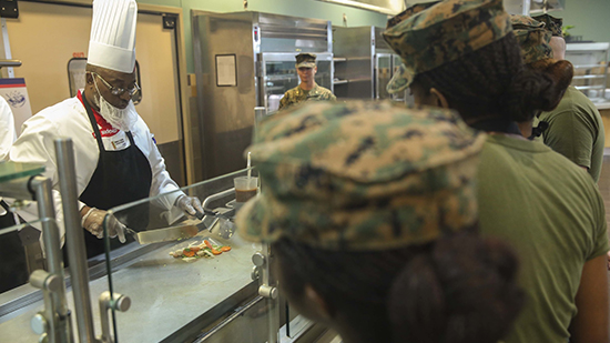 sodexo chef serving soldiers food