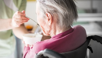 Elderly lady eating