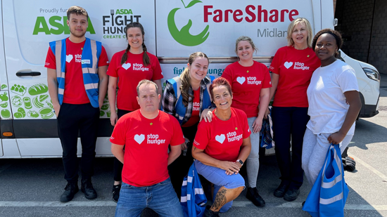 Group of volunteers in front of a FareShare van