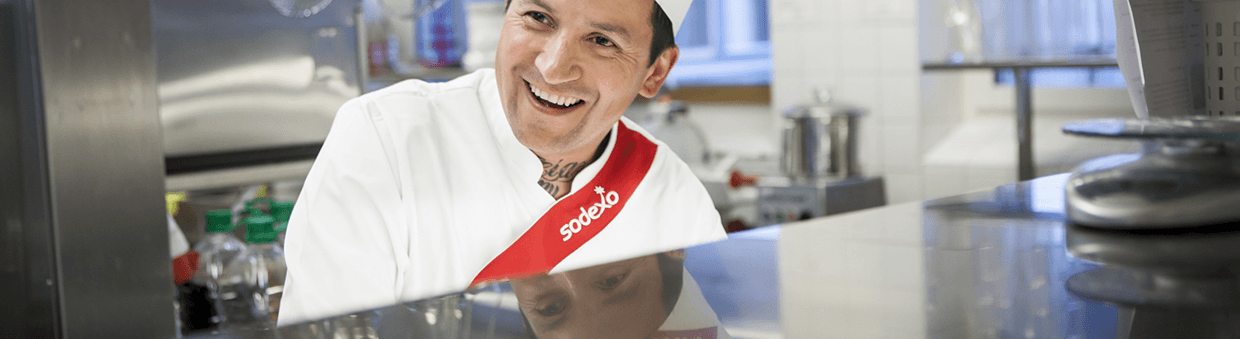 Sodexo chef smiling in a kitchen