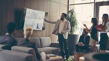 Man presenting to a group of people