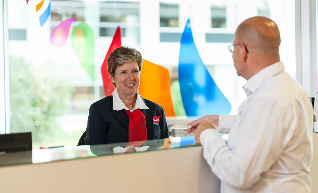 Concierge serving a customer