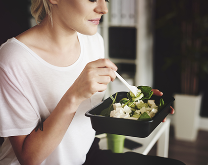 Woman eating healthy lunch