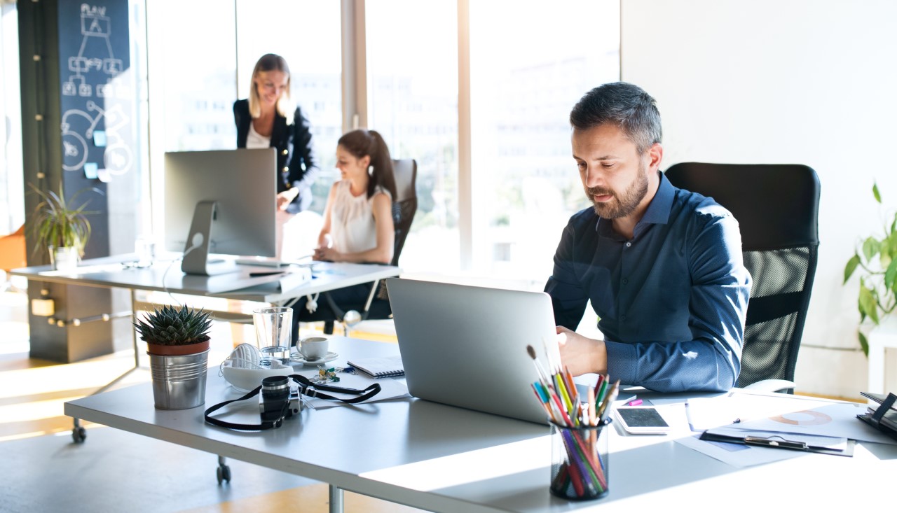 Workers in well-lit office
