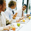 Three men haing a lunch break