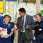 Employees in hospital corridor