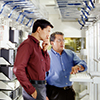 Two men in an IT server room